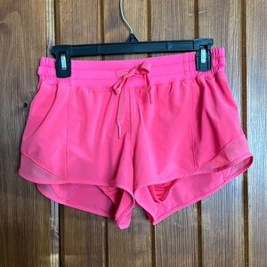 Lululemon hot pink ‘Hotty Hot Low Rise’ shorts 2.5”